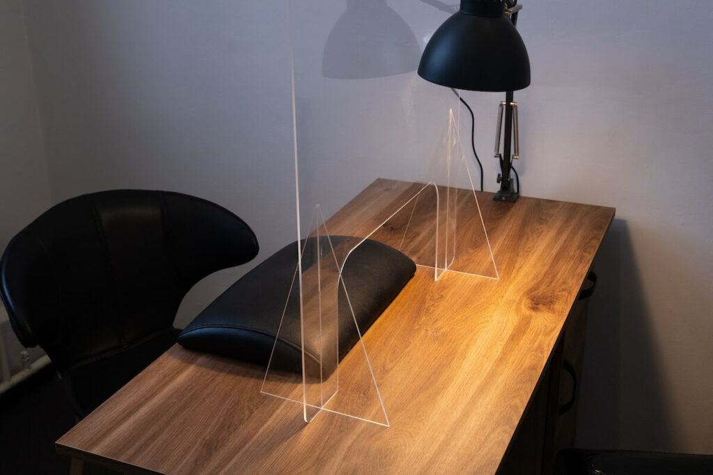 A table with a protective plexiglass