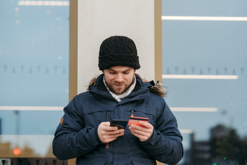 Man using a card for purchasing online