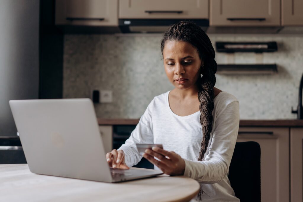 A woman making an online purchase through a laptop