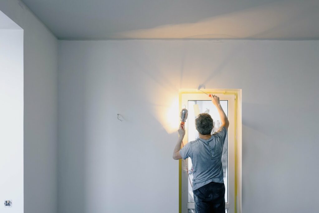 A man installing a door handle