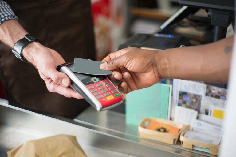 Person paying for something with a card.